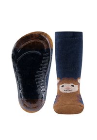 Niebieskie skarpetki z brązowym nadrukiem twarzy zwierzęcia. Podeszwa ma teksturowaną, antypoślizgową powierzchnię, kontrastującą z miękką dzianiną u góry.