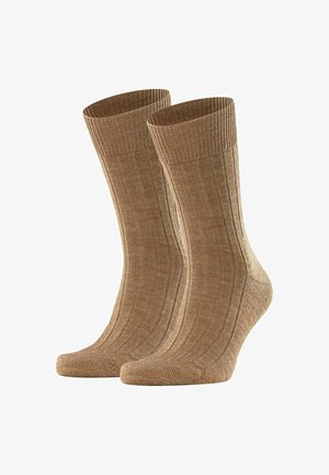 Brown ribbed socks made of a textured material, featuring a cushioned sole and reinforced toe, standing side by side.