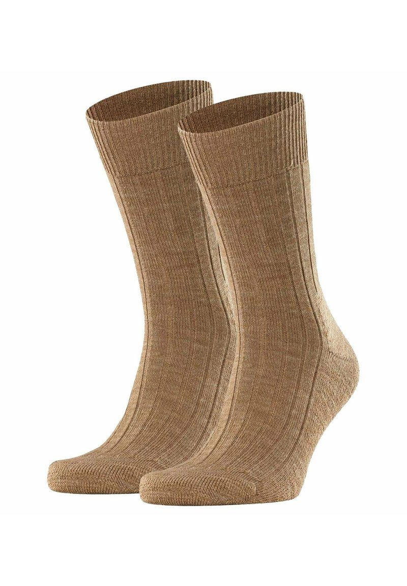 Calze a coste marroni realizzate in un materiale testurizzato, con una suola imbottita e punta rinforzata, in piedi affiancate.