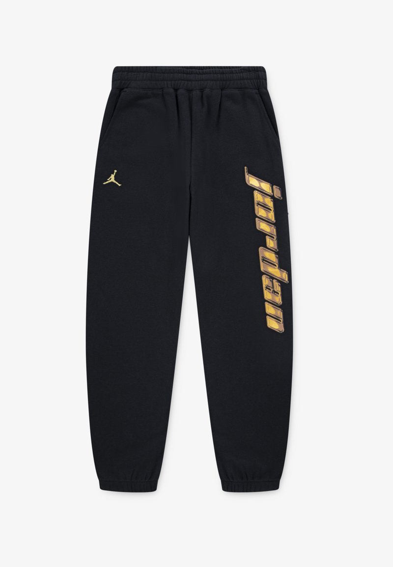 Černé tepláky s elastickým pasem a manžetami na kotnících. Zlaté logo Jordan a grafika "jordan" tištěná vertikálně na levé noze.