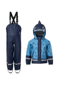Pantalon imperméable bleu marine pour enfants avec bretelles et une veste imperméable bleue à motif requin avec capuche requin et bandes réfléchissantes.