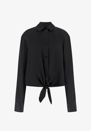 Zwarte blouse met lange mouwen, knoopsluiting, puntkraag en een voorstrik bij de taille, rechte manchetten en een ontspannen pasvorm.