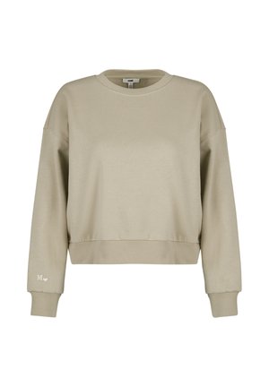 Beige cropped sweatshirt made of soft fabric. Features a round neck, long sleeves, ribbed cuffs, and a small logo accent on the sleeve.