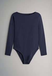 Tumesinist pikkade varrukatega kehasärk pehmest kangast, ümara kaelusega ja turvalise kinnitusega alt nupud.