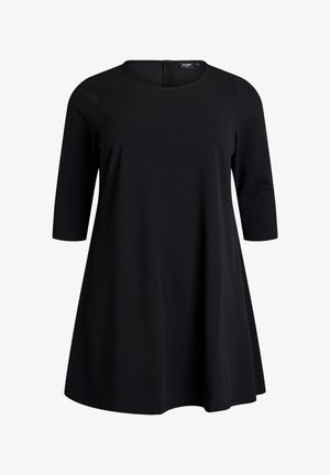 Vestido negro con escote redondo, mangas tres cuartos y una silueta acampanada en A. Confeccionado en un tejido suave y liso, con costuras mínimas.