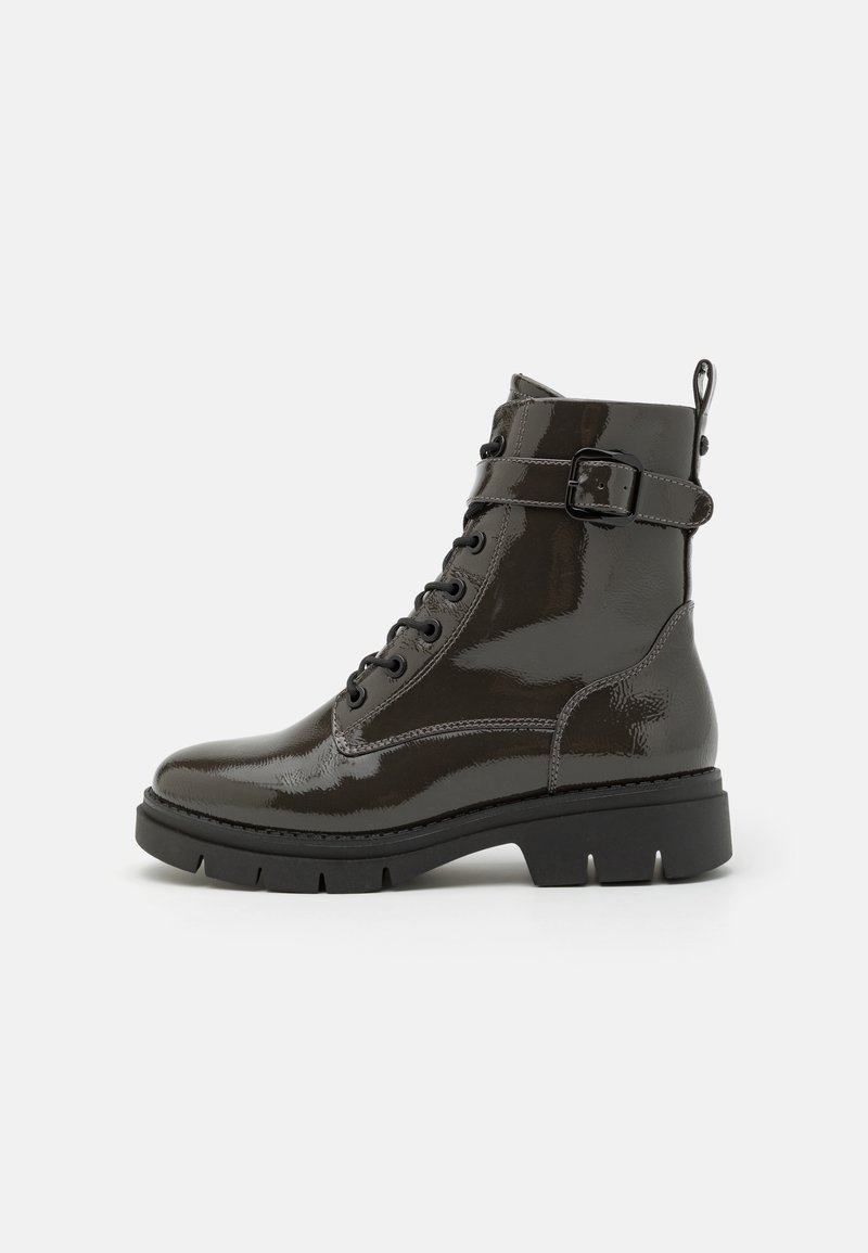 Black patent leather ankle boots with a lace-up front, buckle strap detail, and chunky rubber sole. Side loop for easy on-off.