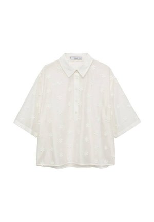 Witte korte mouwen blouse met een kraag, voorzien van een reliëf bloemenpatroon. Gemaakt van lichte stof, heeft het een ontspannen pasvorm en knoopsluiting.