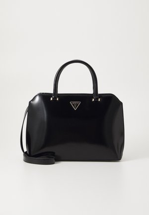 Black handbag made of patent leather with twin handles, a detachable shoulder strap, and a triangular metal logo on the front.