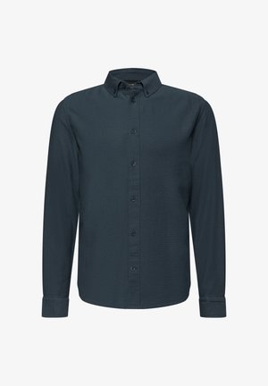 Tummansininen pitkähiha Shirt, joka on valmistettu rakenteellisesta puuvillasta. Siinä on napitettava kaulus, täysi etunappisuljenta ja nappihaalarit.