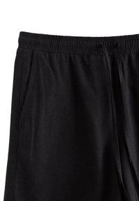 Pantaloni jogging neri con elastico in vita, cordoncino, tasche laterali e texture morbida. Design classico adatto per un abbigliamento casual.