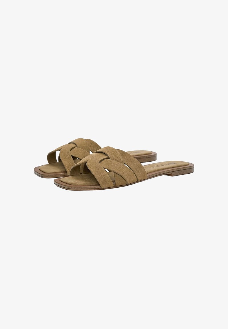 Brown suede slide sandals with crisscross strap design and a flat sole. Soft texture and minimalistic shape. Suitable for casual wear.