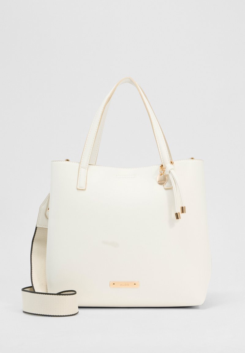 Sac fourre-tout en cuir blanc avec doubles poignées, bandoulière en tissu beige amovible et logo et accents en or ALDO.