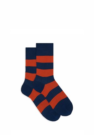 Calze a costine caratterizzate da strisce alternate blu navy e arancioni. Realizzate in tessuto elasticizzato per il massimo comfort.
