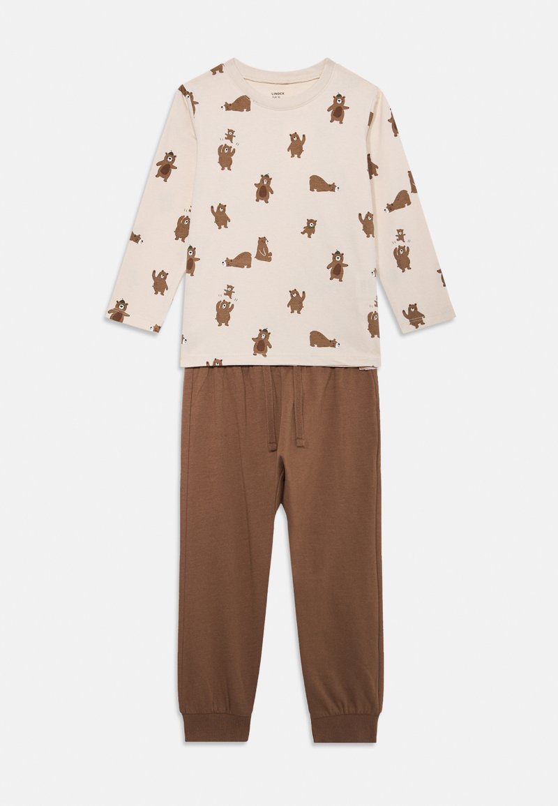 Dvodelni pidžama set; dugih rukava kremasti gornji dio s smeškim životinjskim uzorkom, uparen s smeškim hlačama s elastičnim strukom. Mekani pamučni materijal.