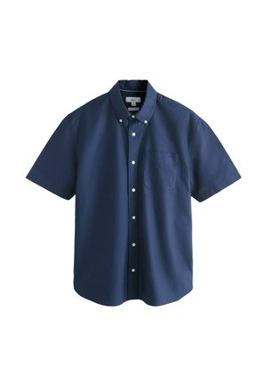 Tumši zila īsroku pogājama krekls ar pogājamu apkakli un krūšu kabatu, attēlots plakani uz balta fona.