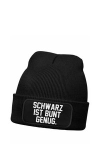Black knit beanie with ribbed texture and a folded cuff. Features a rectangular patch with white text reading "SCHWARZ IST BUNT GENUG."