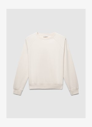 Felpa beige chiaro con maniche raglan, collo rotondo e polsini e orlo a coste. Realizzata in materiale morbido, ha una texture liscia.