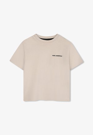 Beige cropped t-shirt van zachte katoen, met een ronde hals, korte mouwen en een zwart logo op de linkerborst.