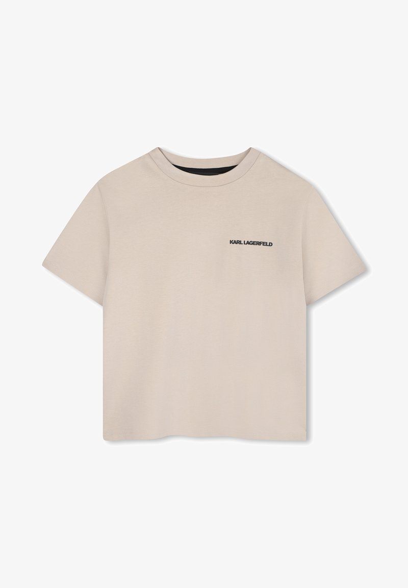 Beige cropped t-shirt van zachte katoen, met een ronde hals, korte mouwen en een zwart logo op de linkerborst.