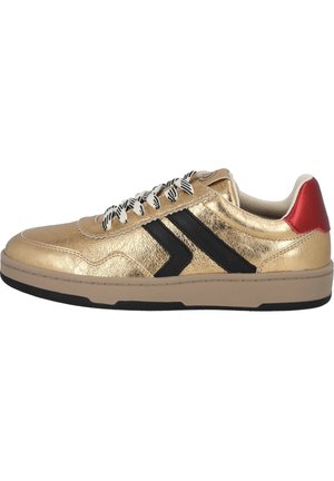 Gold synthetic leather sneaker with black stripes, white and black patterned laces, and red accents on the heel. Flat rubber sole.