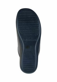 Black rubber shoe sole with ridged texture, slightly curved shape, and a rounded heel. Features a small embossed number indicating size.