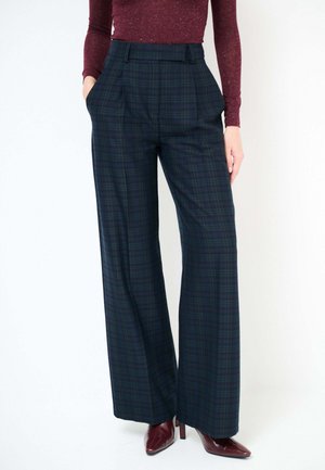 Pantaloni a gamba larga a quadri in blu scuro, verde e bordeaux. Realizzati in tessuto strutturato con vita alta e tasche laterali.