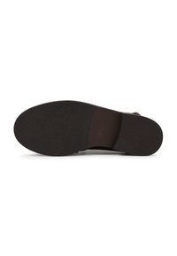 Black rubber shoe sole with a textured grip pattern, featuring a smooth finish and a slightly raised heel area for added support.
