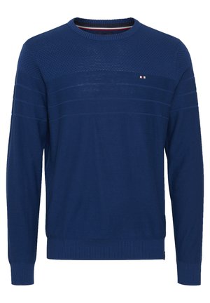 Tamsiai mėlynas megztinis su apvalia iškirpte, tekstūruotu viršutiniu sluoksniu, dryžuotu dizainu ir raižytomis rankovėmis bei apatine dalimi. Mažas logotipas krūtinėje.