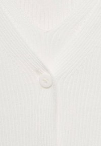 White ribbed knit cardigan featuring a V-neckline and a single white button closure at the front. Soft texture and fitted design.