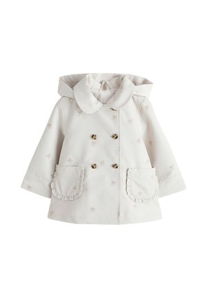 Kreemikas väikelapse mantel kapuutsiga, kahekordse nööpidega, väikeste lipsumustrite ja eest volditud taskutega.