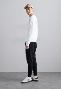Dsquared2 RELAX DEAN FIT - Tracksuit bottoms - black