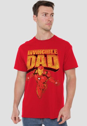 Red cotton t-shirt featuring a large graphic design of Iron Man and the text "INVINCIBLE DAD" in bold yellow with a distressed finish.