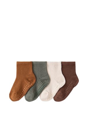 Four pairs of ribbed baby socks in brown, green, cream, and dark brown, each with non-slip grips on the soles, arranged in a row.