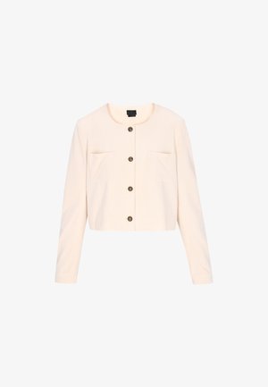 Jachetă croită de culoare crem, cu decolteu rotund, mâneci lungi, două buzunare frontale și patru butoane negre pe centru.