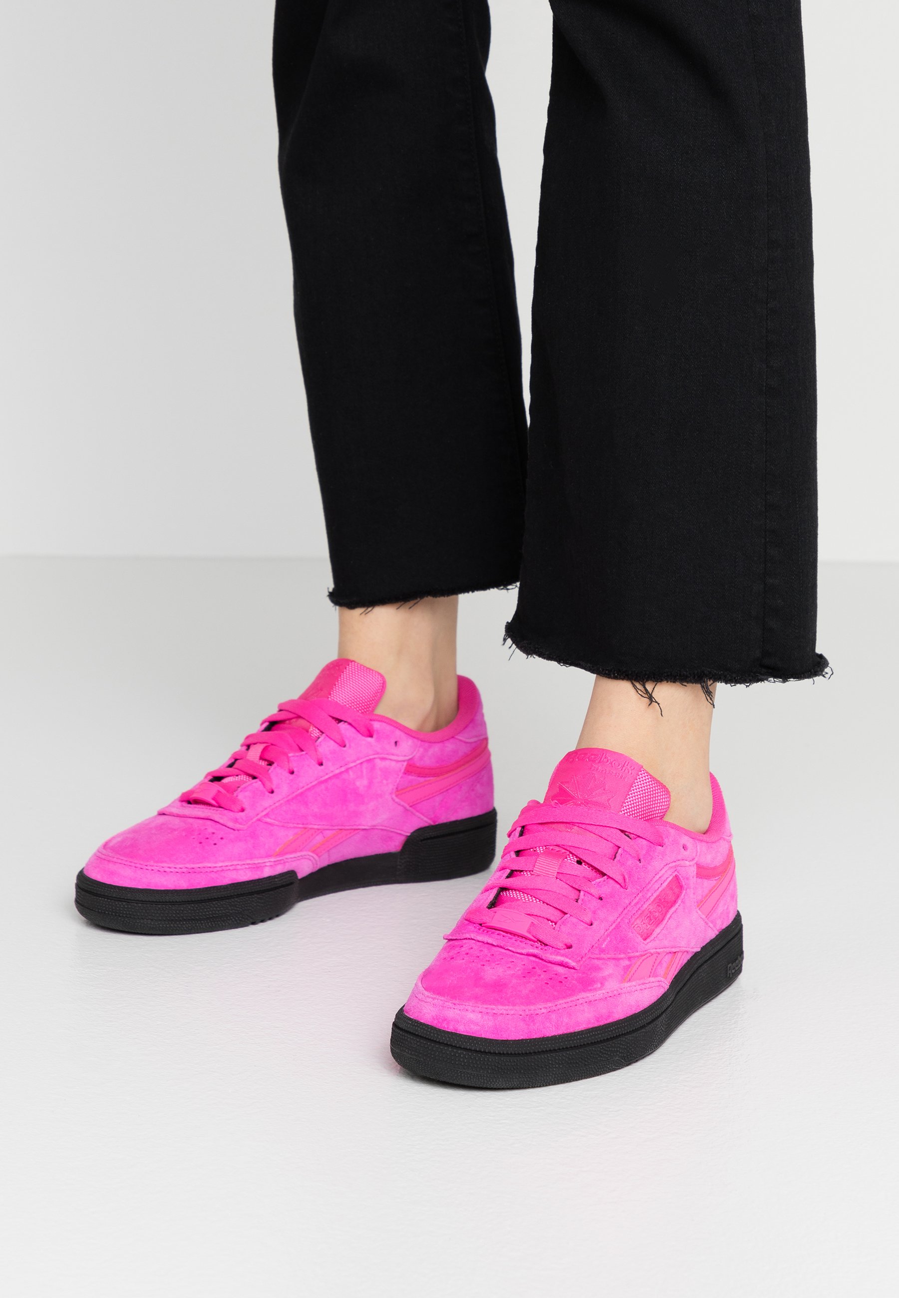 pink and black reebok