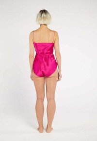 Fuchsia satin one-piece swimsuit with thin spaghetti straps and a form-fitting design, featuring a smooth texture and fitted bodice.