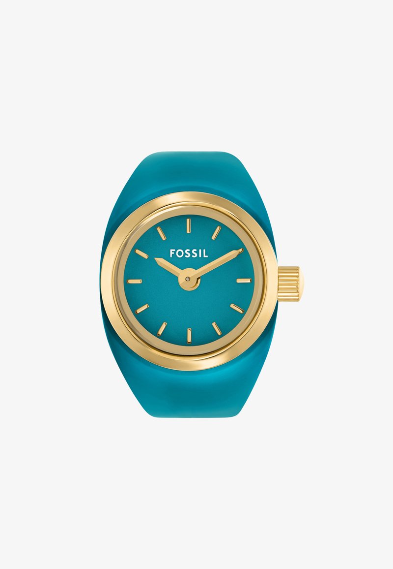 Turquoise silicone strap watch with a gold-tone round case, features a blue dial, gold hands, and a textured crown. Brand: Fossil.