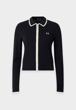 Cardigan noir à manches longues zippé avec bordure blanche sur le col, la fermeture éclair, les poignets et un petit logo de laurier sur la poitrine gauche.