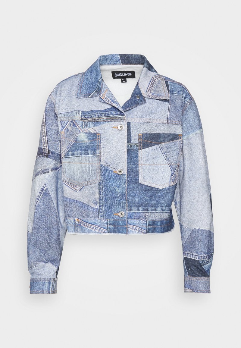 Cropped denim jacket featuring a patchwork design in varying shades of blue, with multiple pockets and metal button closure.