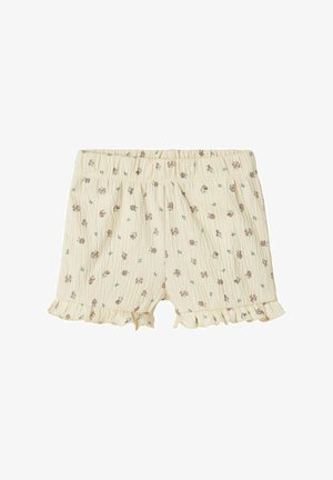 Shorts beige chiaro realizzati in tessuto testurizzato, con un motivo floreale marrone e verde, dotati di una vita elastica arricciata e orli volant.