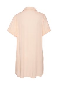 Camicia a maniche corte in tessuto pesca chiaro, con colletto classico e manicotti arrotolati. Tessuto morbido e vestibilità relax con orlo curvo.