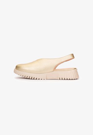 Gold textured leather slingback shoe with thick beige ridged sole, closed toe, and open heel, shown in profile on white background.