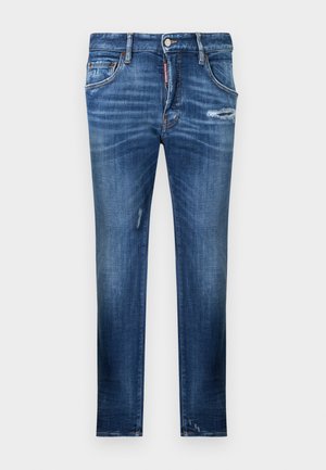 Modré úzké džíny s vybledlými a ošuntělými detaily na předních stehnech a kolenou, pětikapsový styl a zapínání na knoflíky.