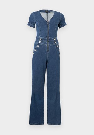 Ολόσωμη φόρμα τζιν με κοντά μανίκια, βαθύ V λαιμόκοψη, εμπρόσθιο φερμουάρ και διακοσμητικά κουμπιά στα πλάγια· καμπανούσα σχεδίαση παντελονιού σε σκούρο μπλε.