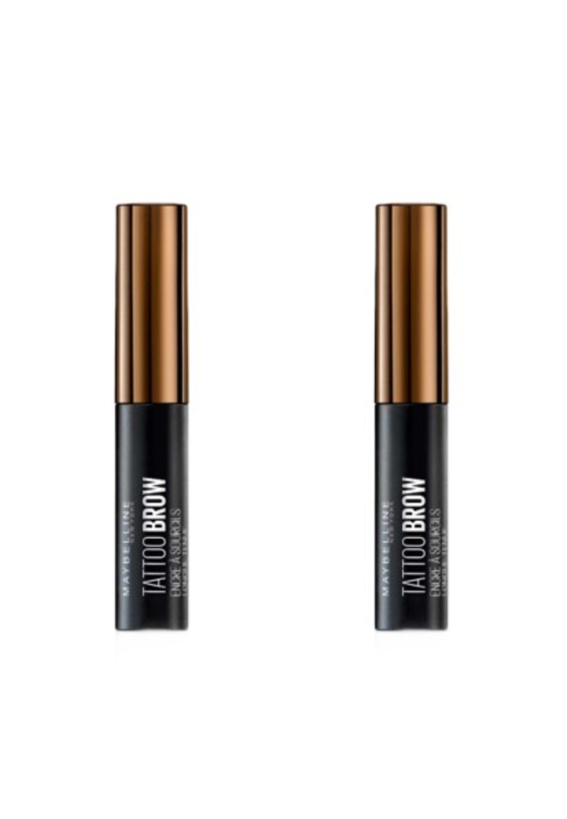 Deux tubes de teinture pour sourcils noirs avec des bouchons en bronze, étiquetés "Tattoo Brow" en texte blanc sur le corps noir. Texture lisse et mate.