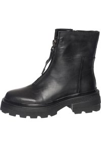 Bottine en cuir noir avec semelle épaisse en caoutchouc à crampons et fermeture éclair à l'avant.