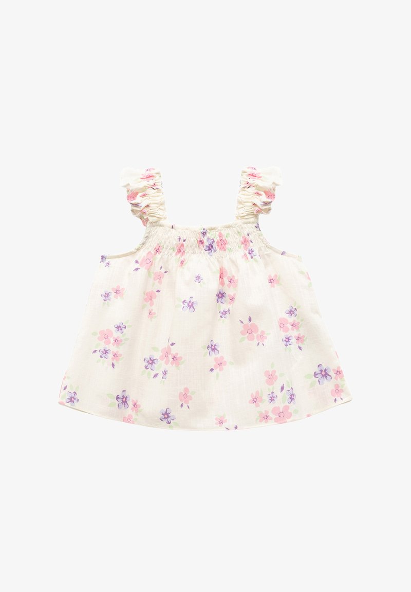 Hvid blomstret top med rosa og lilla blomster, der har flæsebesætning og smocket liv. Letvægts, åndbart stof med en afslappet pasform.