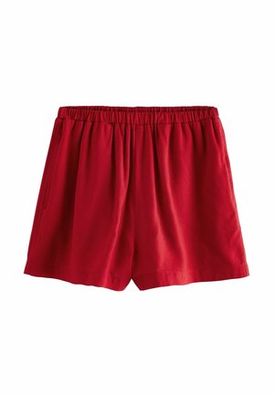 Röda bomullsshorts med elastisk midja, med en lös passform och två sidofickor. Slät textur och enkel design.