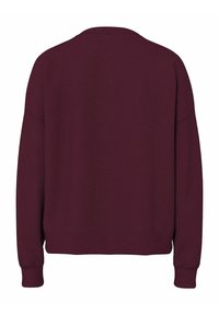 Bluza bordowa z okrągłym dekoltem, opuszczonymi ramionami, ściągaczami na rękawach i u dołu. Wykonana z miękkiej, gładkiej tkaniny w jednolitym kolorze.