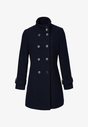 Cappotto di lana navy con doppio petto, sei grandi bottoni, colletto alto e maniche arrotolate. Forma sartoriale e tasche laterali.